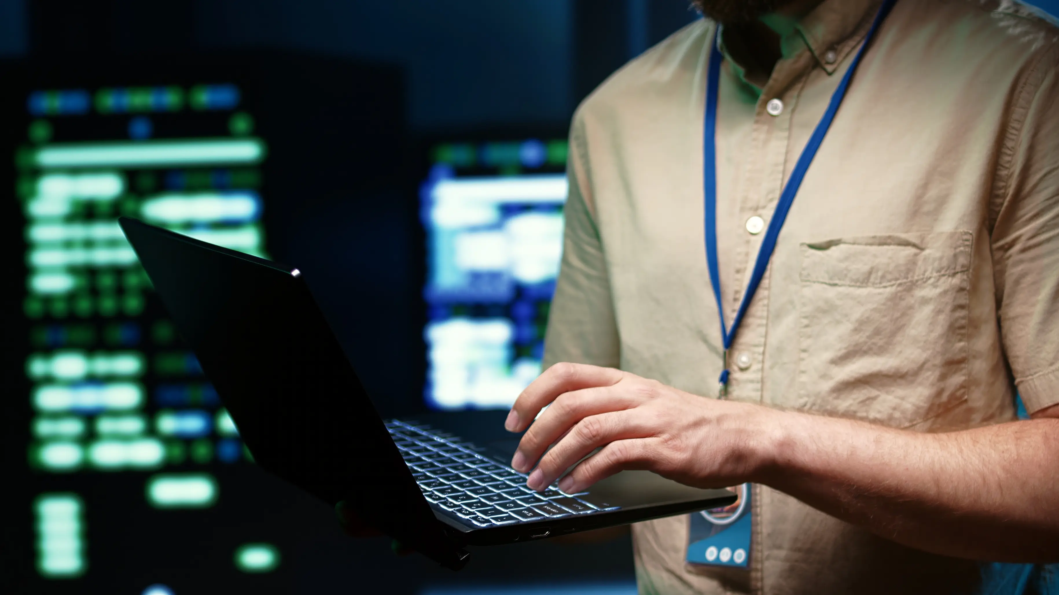 Person performing maintenance on a laptop in a data center