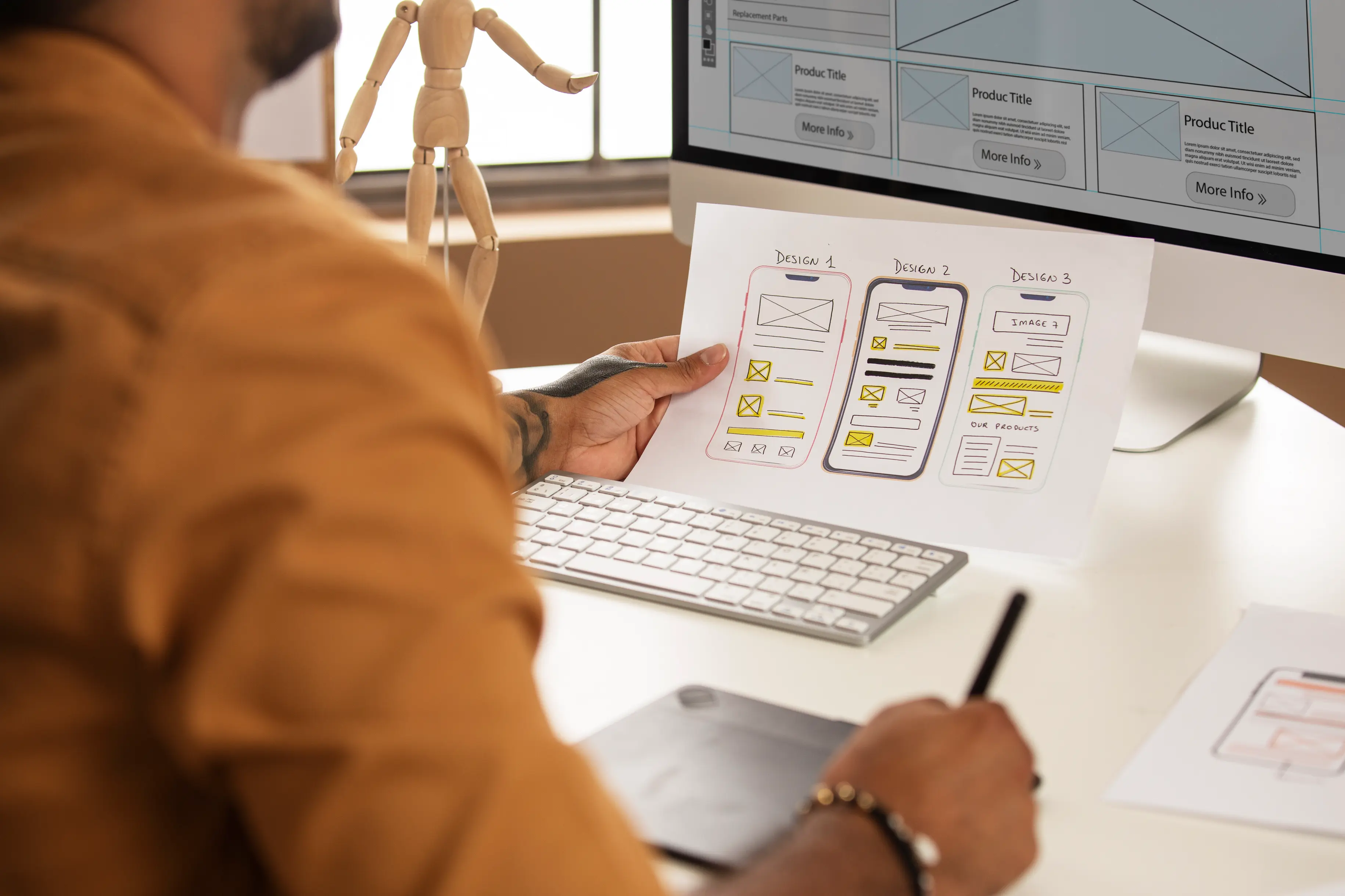 Person sketching mobile design ideas with a stylus